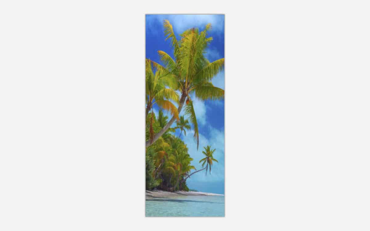 A canvas art print featuring a tropical beach scene with palm trees, clear blue sky, and calm sea waters.