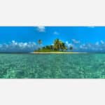 A vibrant art piece featuring a small tropical island with palm trees surrounded by crystal clear turquoise waters under a blue sky with fluffy clouds.