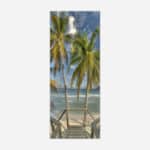 A vertical panoramic art print of a wooden staircase leading down to a serene beach flanked by tall palm trees with a beautiful blue ocean in the background.