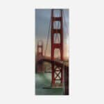 A panoramic wall art canvas featuring the Golden Gate Bridge in San Francisco during sunset with warm lighting and coastal elements.
