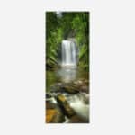 A photographic art piece of a serene waterfall cascading into a calm river surrounded by lush greenery.