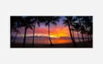 A vibrant art print of a tropical beach sunset with silhouetted palm trees against a colorful sky.