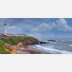 A painting of a lighthouse on a cliff overlooking a beach with waves and cloudy skies.