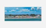 A vibrant art print featuring a seaside amusement park with a roller coaster, colorful buildings, beachgoers, and a clear blue sky.