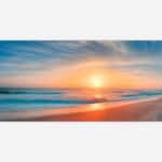 A panoramic view of a beach at sunset with the sun reflecting on the water and wet sand, featuring a colorful sky and gentle waves.